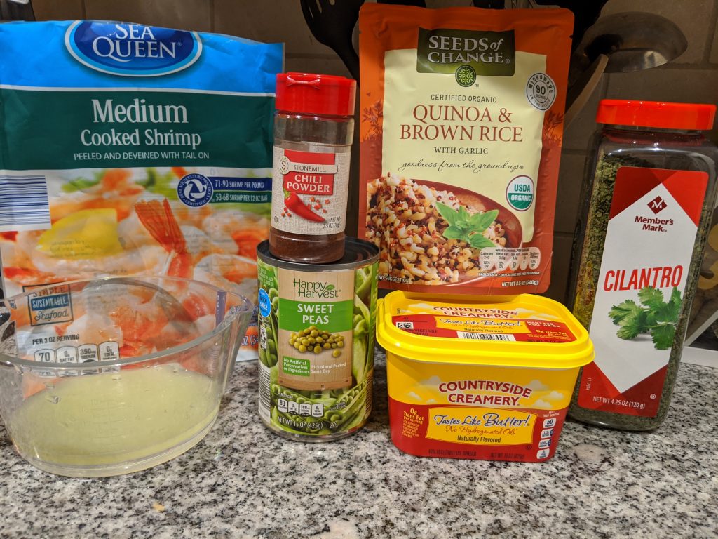 Ingredients for Chili Lime Shrimp Over Quinoa: Shrimp, lime juice, chili powder, peas, quinoa & brown rice, light butter, and cilantro.