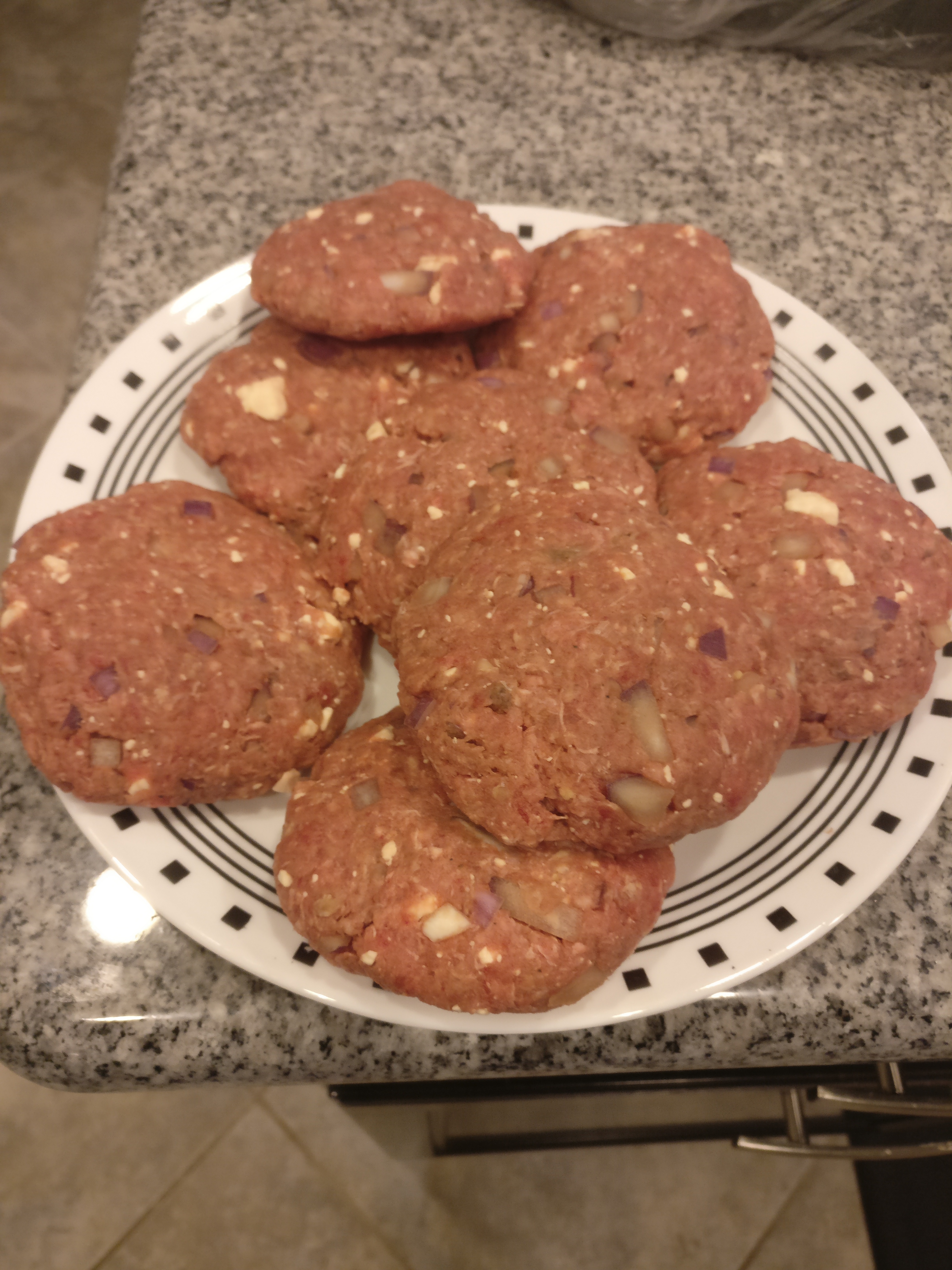 Greek Burgers stuffed with red onion and feta.