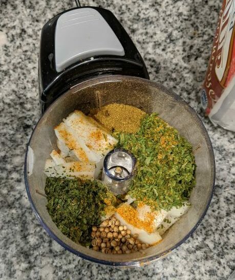 Falafel Ingredients in Chopper - Cilantro, Parsley, Cumin, Coriander Seeds, and Onion