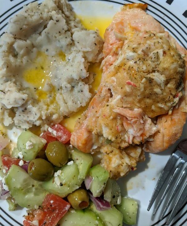 Plate with Mashed Potatoes, Cucumber Salad, and Crab Stuffed Salmon from Costco