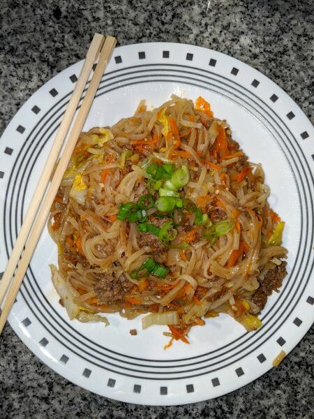 Hoisin Beef Noodles on plate with chopsticks