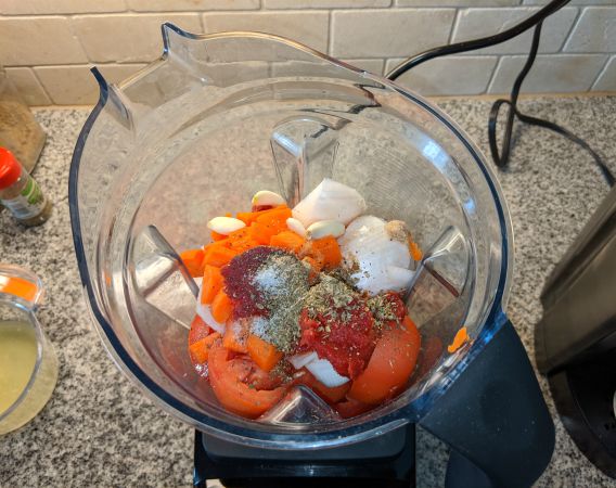 Tomato Sauce Ingredients in Vitamix Blender, Tomatoes, Carrots, Herbs, Tomatoes