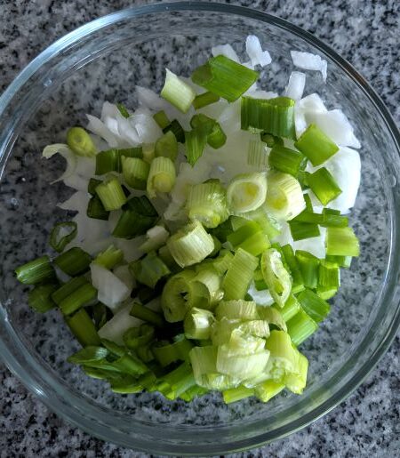 White and Green Onions Chopped in Bowl