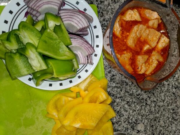 Bell peppers, onion, and chicken in Moroccan seasoned marinade.