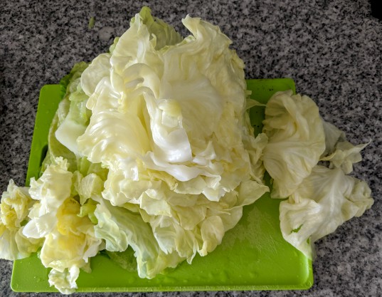 Cabbage leaves on cutting board