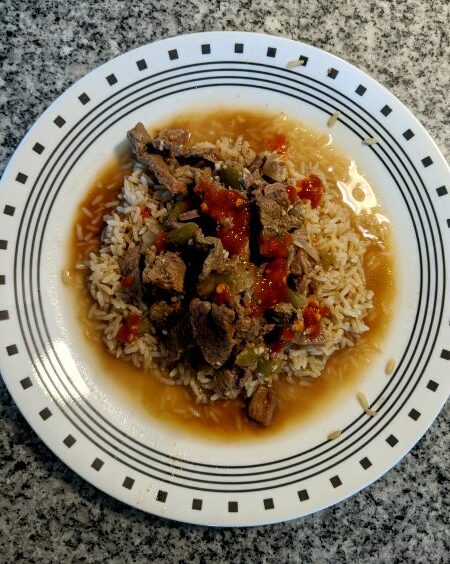 CrockPot Pepper Steak - Beef, Rice, Onions, Peppers on plate