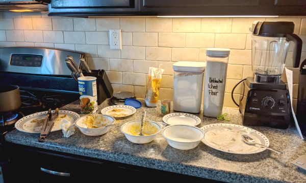 Chicken Kiev Breading Process, bread crumbs, flour, on plates and bowls