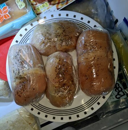 Chicken Kiev - chicken breasts stuffed and wrapped in plastic wrap inside freezer