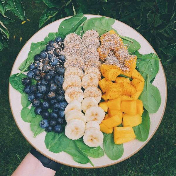 Plate with Spinach, Blueberries, Bananas, and Mangoes