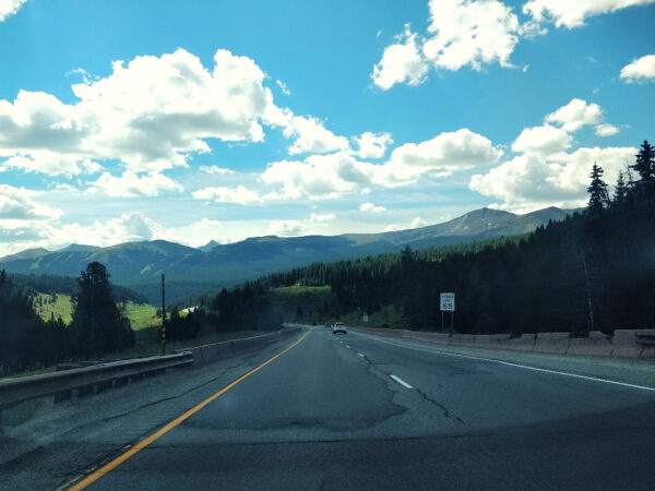 HIghway surrounded by trees and mountains outside of Copper Mtn. Colorado