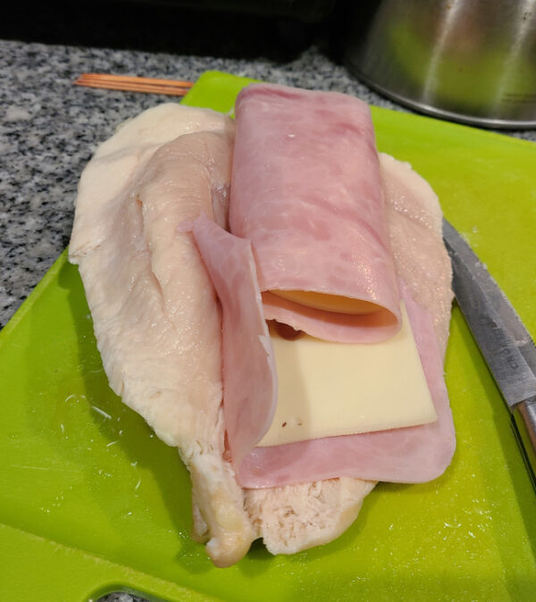 Chicken breast with ham and cheese in side. Before Cooking
