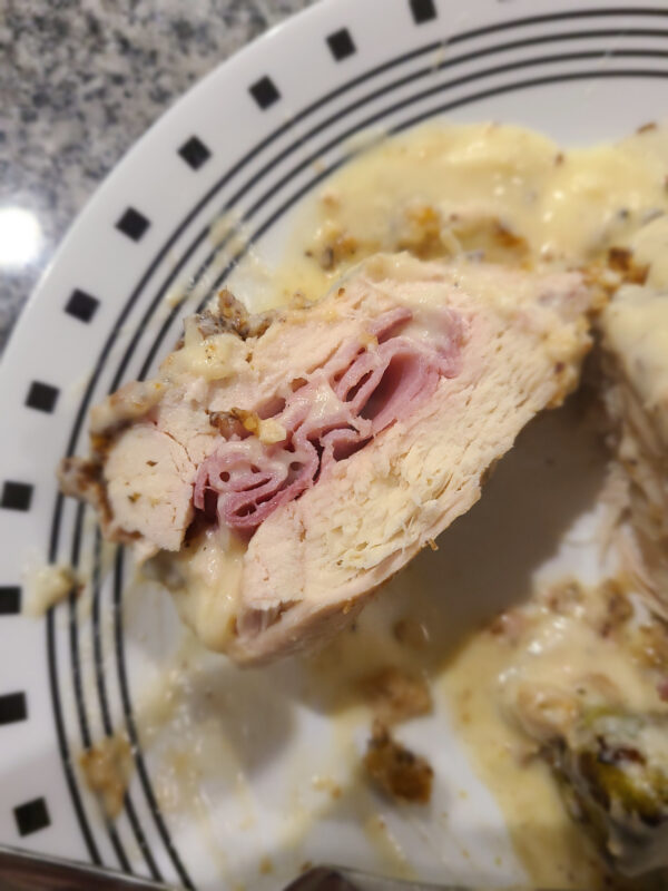 Slice of Chicken Cordon Bleu - chicken stuffed with ham and Swiss cheese then baked