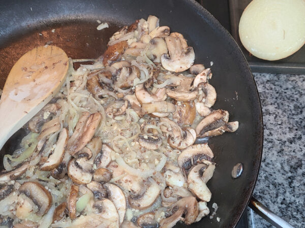mushrooms, onion, and garlic cooking in pan