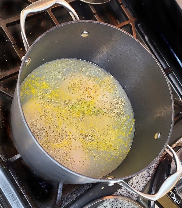 Chicken boiling in pot