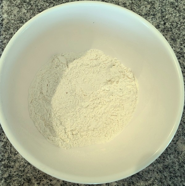 Sifted flour and baking soda in bowl