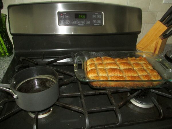 Baklava with syrup before adding