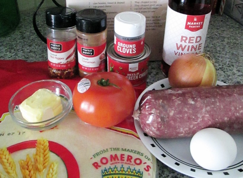 Chimichanga ingredients - spices, cooking wine, chorizo, vegetables, egg, toritillas