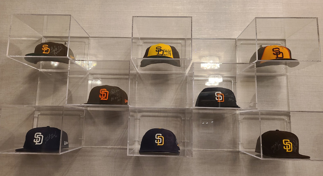 Former Padres hats on display in Home Plate Club at Petco Park