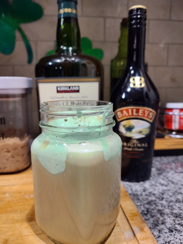 Irish Coffee with Ingredients in the background