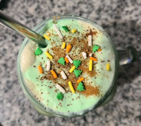 Bailey's Infused Whipped Cream with sprinkles on top of Irish Coffee