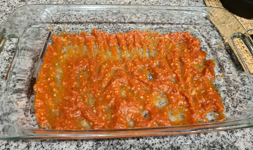 Marina sauce coating baking dish.