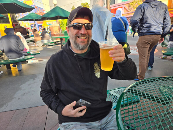 Man holding a beer at Duff Brewery