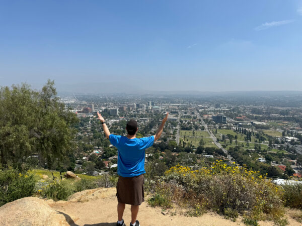Man overlooking downtown Riverside, CA from the top of Mt. Rubidoux