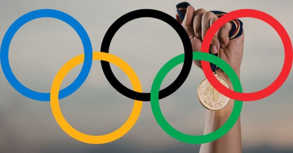 Olympic Rings with Hand holding Medal